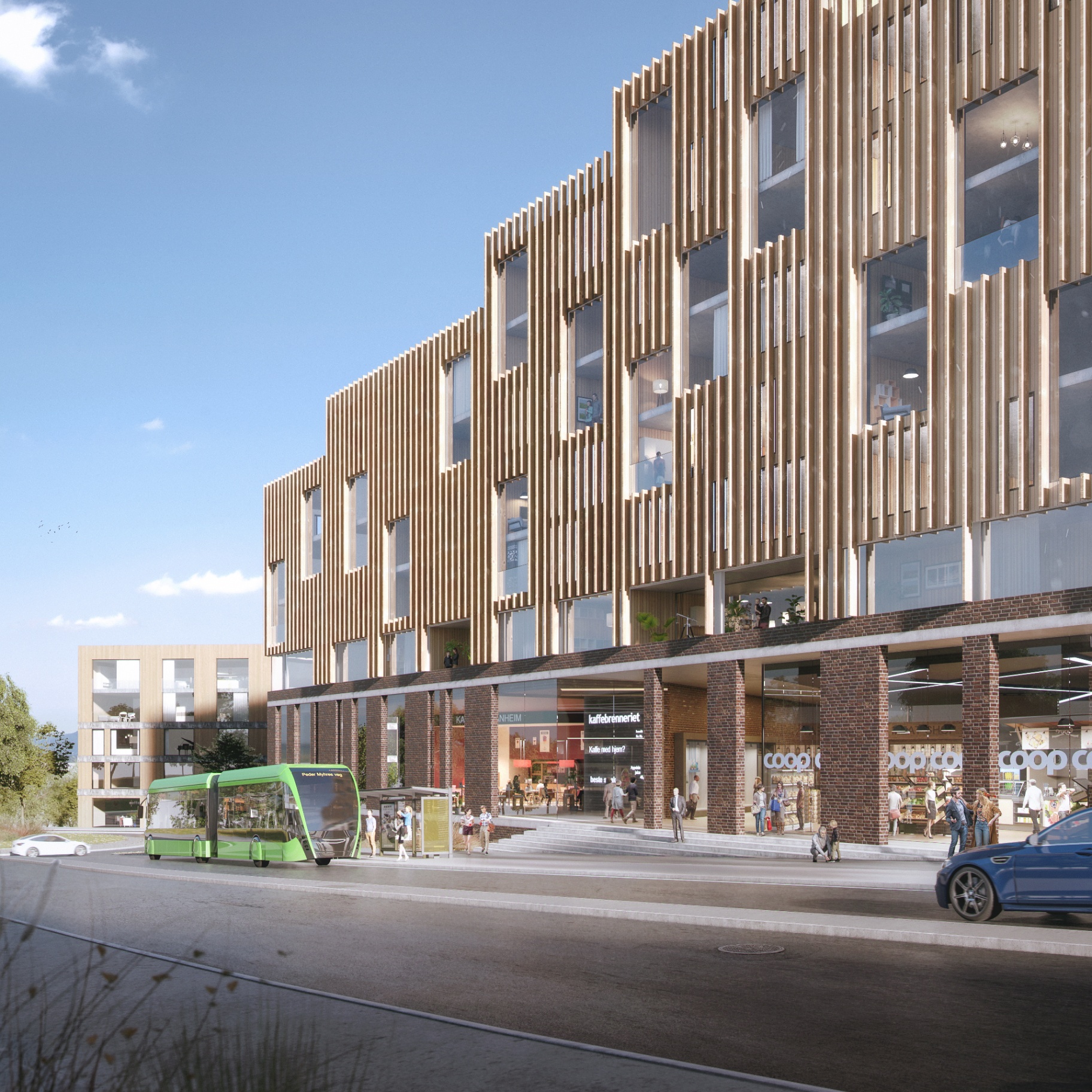 Fasade med trespiler over inngangen til Coop og kaféen på torget